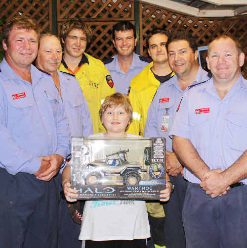 FIRIES TO THE RESCUE: Emerald firefighters present 11-year-old birthday boy Ryan Cross with a new Xbox to replace the one he lost in a housefire on Wednesday afternoon. rp-021210-047 FIRIES TO THE RESCUE: Emerald firefighters present 11-year-old birthday boy Ryan Cross with a new Xbox to replace the one he lost in a housefire on Wednesday afternoon. rp-021210-047